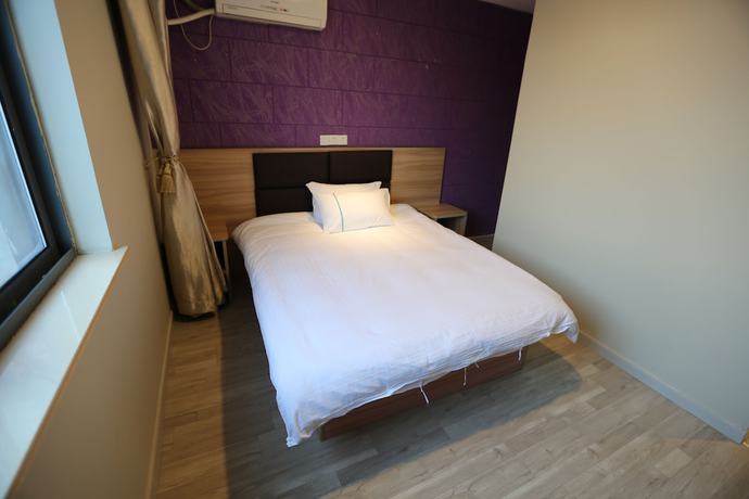 Imagen de la habitación del Hotel Shanghai xiannuo luxury hotel. Foto 6