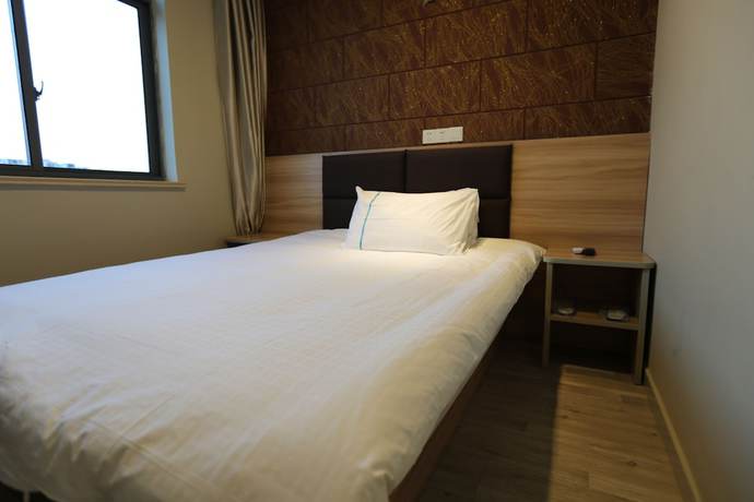 Imagen de la habitación del Hotel Shanghai xiannuo luxury hotel. Foto 8