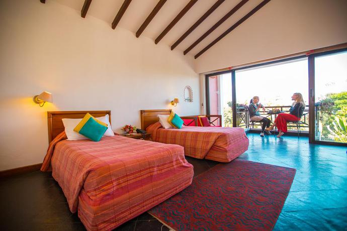 Imagen de la habitación del Hotel Shangri La Village Resort. Foto 4