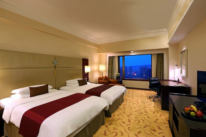 Imagen de la habitación del Hotel Shangri-la Dalian. Foto 7