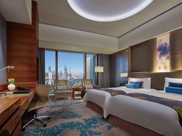 Imagen de la habitación del Hotel Shangri-la Tianjin. Foto 2
