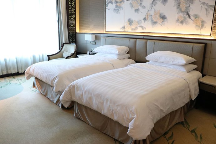 Imagen de la habitación del Hotel Shangri-la Yangzhou. Foto 3