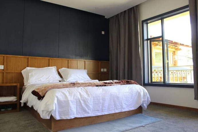Imagen de la habitación del Hotel Shangri-la Youyou Inn. Foto 19