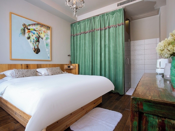 Imagen de la habitación del Hotel Shangzhi Qushe Resort. Foto 2