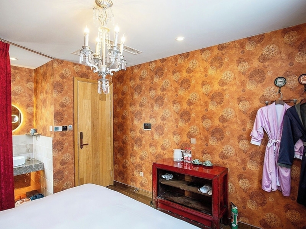 Imagen de la habitación del Hotel Shangzhi Qushe Resort. Foto 4