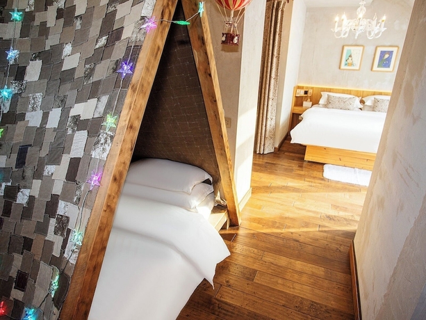 Imagen de la habitación del Hotel Shangzhi Qushe Resort. Foto 6