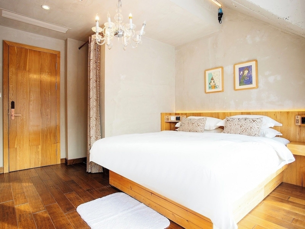 Imagen de la habitación del Hotel Shangzhi Qushe Resort. Foto 7