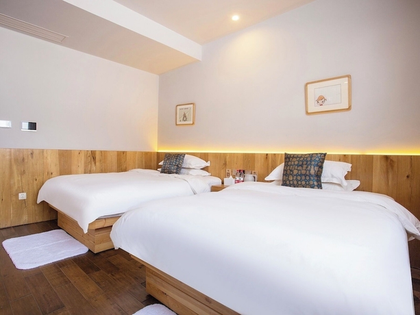 Imagen de la habitación del Hotel Shangzhi Qushe Resort. Foto 9