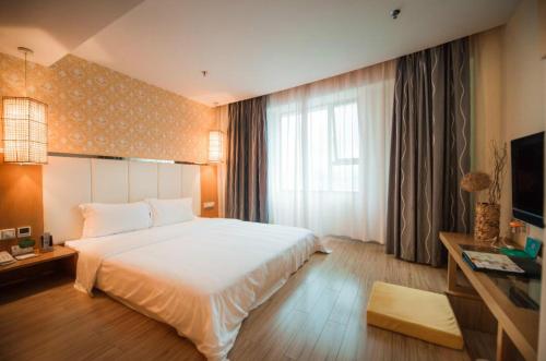 Imagen de la habitación del Hotel Shanshui Fashion Xijiang Road. Foto 6