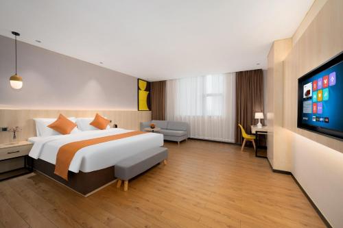 Imagen de la habitación del Hotel Shanshui Trends - Shatian Metro Station Longguang City. Foto 17