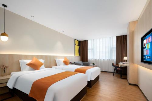 Imagen de la habitación del Hotel Shanshui Trends - Shatian Metro Station Longguang City. Foto 18