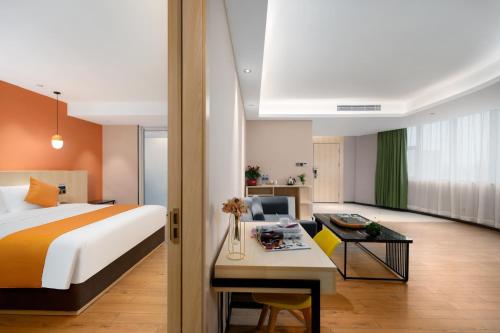 Imagen de la habitación del Hotel Shanshui Trends - Shatian Metro Station Longguang City. Foto 20
