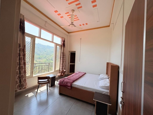 Imagen de la habitación del Hotel ShantiKunj Homestay Nearby Morni Hills Waterfall. Foto 12