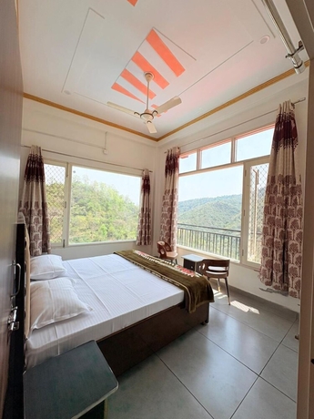 Imagen de la habitación del Hotel ShantiKunj Homestay Nearby Morni Hills Waterfall. Foto 14