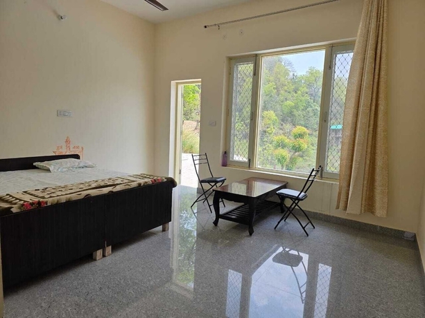 Imagen de la habitación del Hotel ShantiKunj Homestay Nearby Morni Hills Waterfall. Foto 15