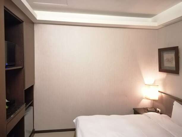 Imagen de la habitación del Hotel Shan-yue Hotspring. Foto 14