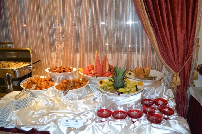 Imagen del bar/restaurante del Hotel Sharjah Apartments - الشارقة. Foto 2