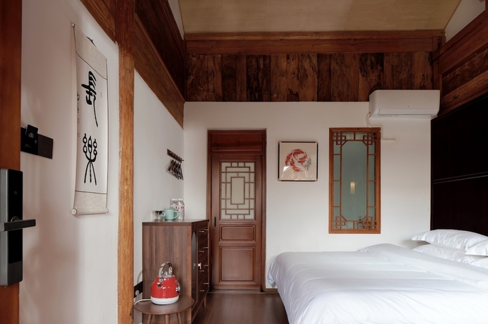 Imagen de la habitación del Hotel Shaxi Ancient Town Chang Le Li Chinese Courtyard. Foto 3