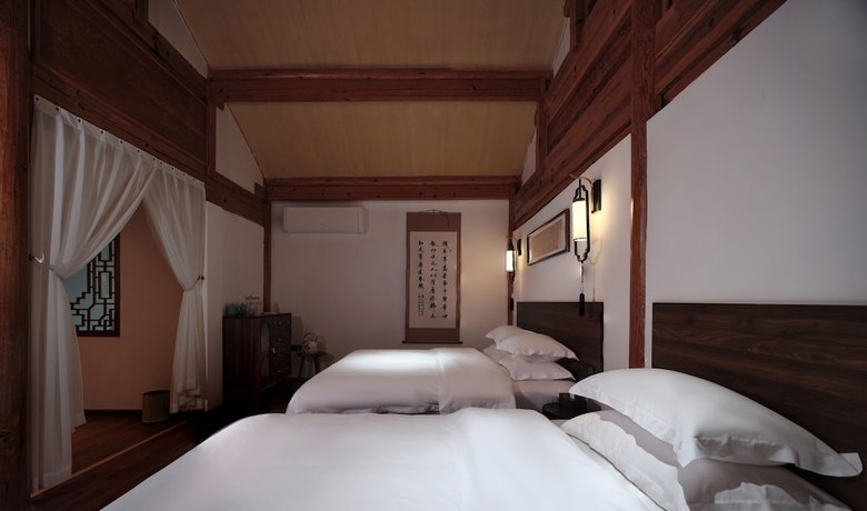 Imagen de la habitación del Hotel Shaxi Ancient Town Chang Le Li Chinese Courtyard. Foto 5