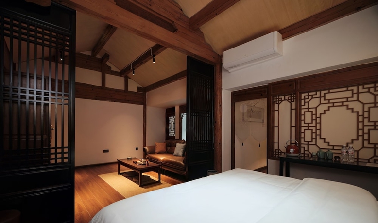 Imagen de la habitación del Hotel Shaxi Ancient Town Chang Le Li Chinese Courtyard. Foto 8
