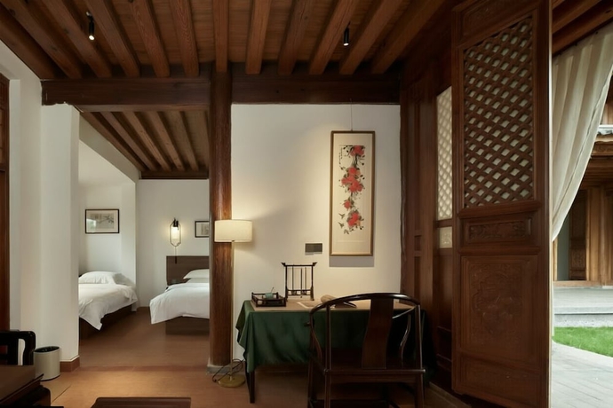 Imagen de la habitación del Hotel Shaxi Ancient Town Chang Le Li Chinese Courtyard. Foto 9