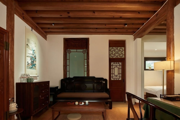 Imagen de la habitación del Hotel Shaxi Ancient Town Chang Le Li Chinese Courtyard. Foto 10