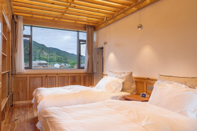 Imagen de la habitación del Hotel Shaxi Upstay. Foto 3