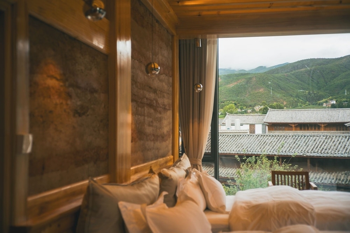 Imagen de la habitación del Hotel Shaxi Upstay. Foto 10