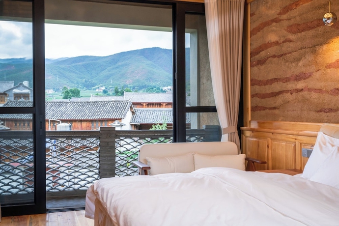 Imagen de la habitación del Hotel Shaxi Upstay. Foto 15
