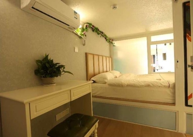 Imagen de la habitación del Hotel Sheandhe Apartment Shenzhen University. Foto 14