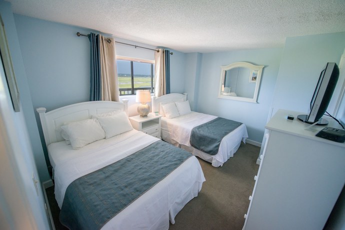 Imagen de la habitación del Hotel Shell Island Resort - All Oceanfront Suites. Foto 12
