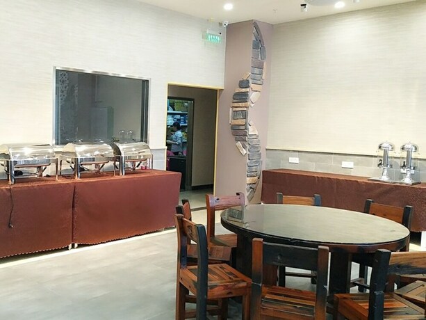 Imagen del bar/restaurante del Hotel Shell Qionghai Boao Town Binhai Road Hotel. Foto 23