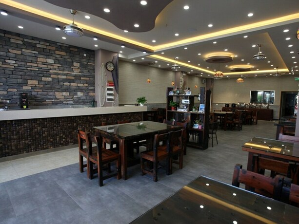 Imagen del bar/restaurante del Hotel Shell Qionghai Boao Town Binhai Road Hotel. Foto 25