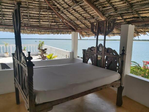 Imagen de la habitación del Hotel Shella Bahari Guest House. Foto 14