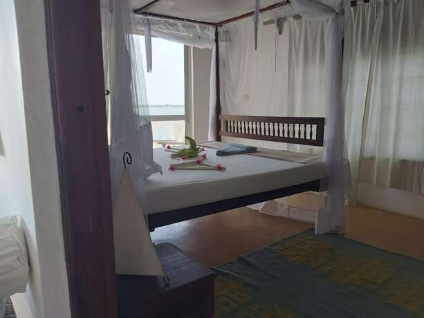 Imagen de la habitación del Hotel Shella Bahari Guest House. Foto 15