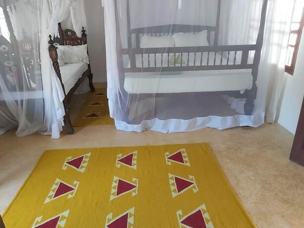 Imagen de la habitación del Hotel Shella Bahari Guest House. Foto 16