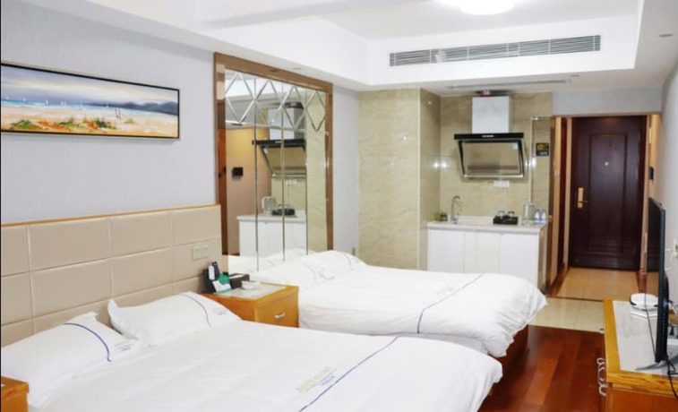 Imagen de la habitación del Hotel Shengang Executive Apartment - Shenzhen The Mixc. Foto 5