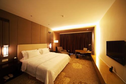 Imagen de la habitación del Hotel Shenglong Jianguo Haiyang. Foto 6