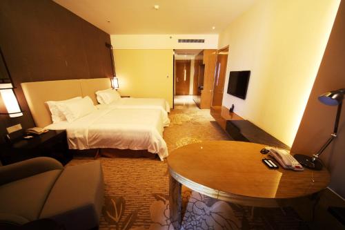 Imagen de la habitación del Hotel Shenglong Jianguo Haiyang. Foto 8