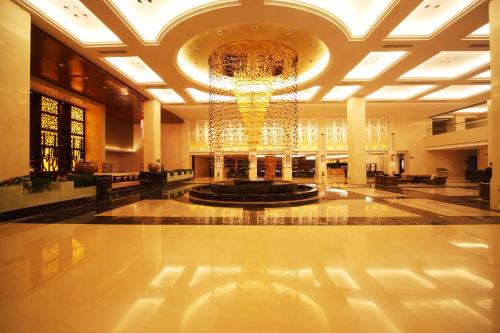 Imagen de la habitación del Hotel Shenglong Jianguo Haiyang. Foto 10