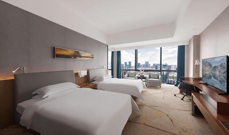 Imagen de la habitación del Hotel Shenzhen Huaqiang Plaza. Foto 7