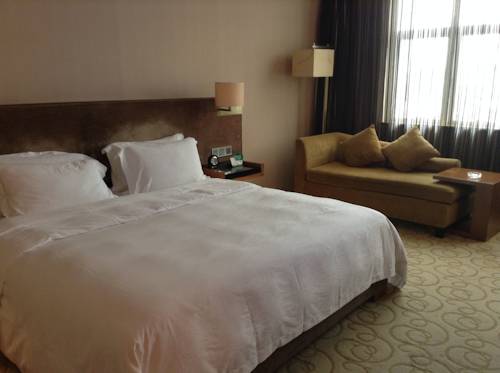 Imagen de la habitación del Hotel Shenzhen Shuidu Holiday, North Railway Station. Foto 8