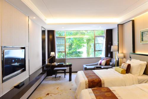 Imagen de la habitación del Hotel Shenzhen Silver Lake Conference Center. Foto 7