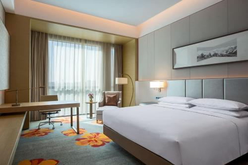 Imagen de la habitación del Hotel Sheraton Beijing Lize. Foto 6