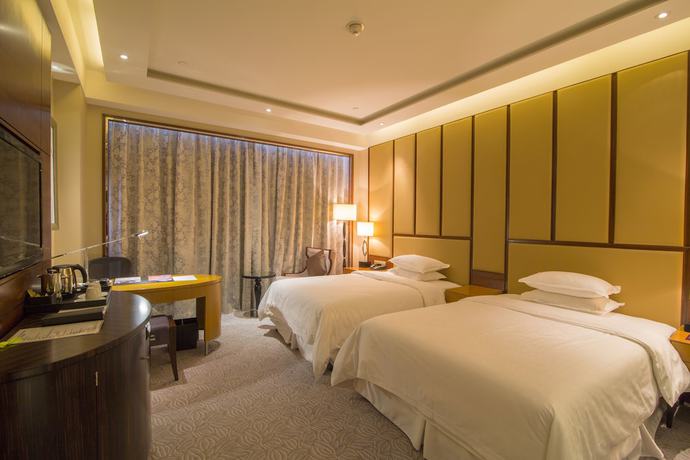 Imagen de la habitación del Hotel Sheraton Qingdao Jiaozhou. Foto 9
