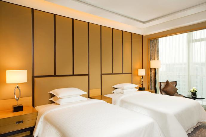 Imagen de la habitación del Hotel Sheraton Qingdao Jiaozhou. Foto 13