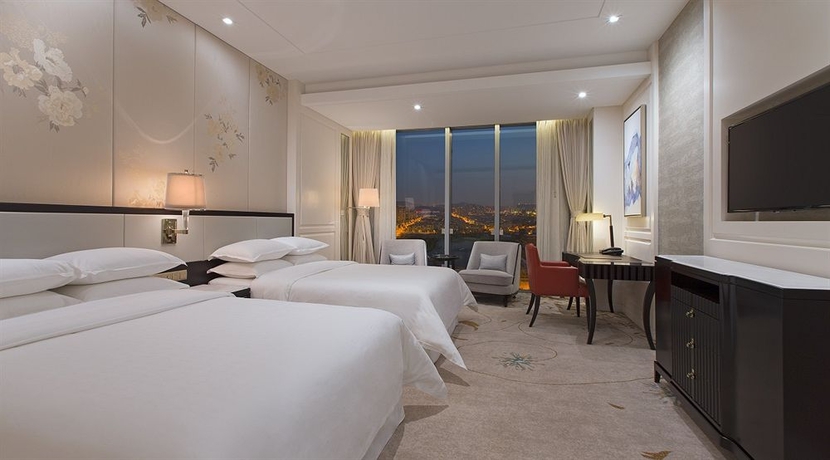 Imagen de la habitación del Hotel Sheraton Qingdao Licang. Foto 7