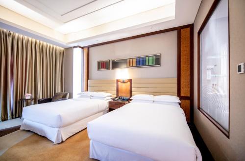 Imagen de la habitación del Hotel Sheraton Tianjin Binhai. Foto 8