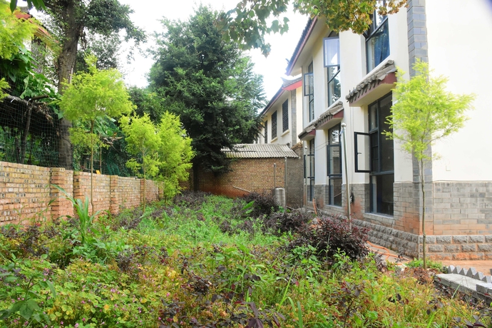 Imagen de los exteriores del Hotel Shi Lin Family Folk Inn. Foto 16
