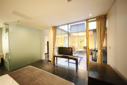 Imagen de la habitación del Hotel Shichahai Sandalwood Boutique Beijing. Foto 5